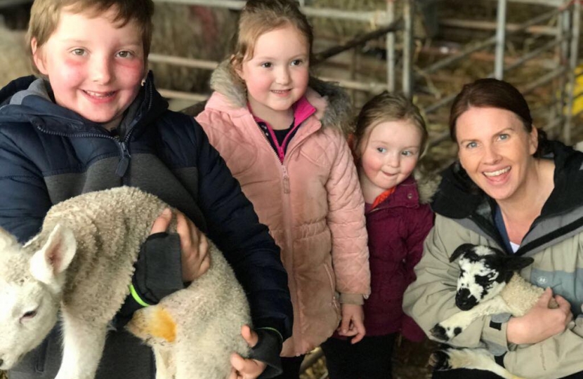 Trudy with Ryan, Jessica and Katie Slater with new born lambs Teddy and Trudy