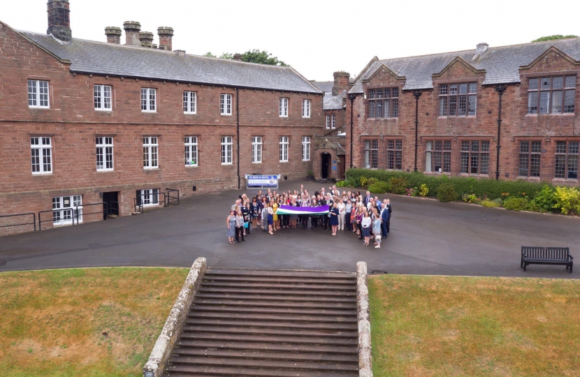 Trudy Harrison welcomes the suffrage flag to Cumbria