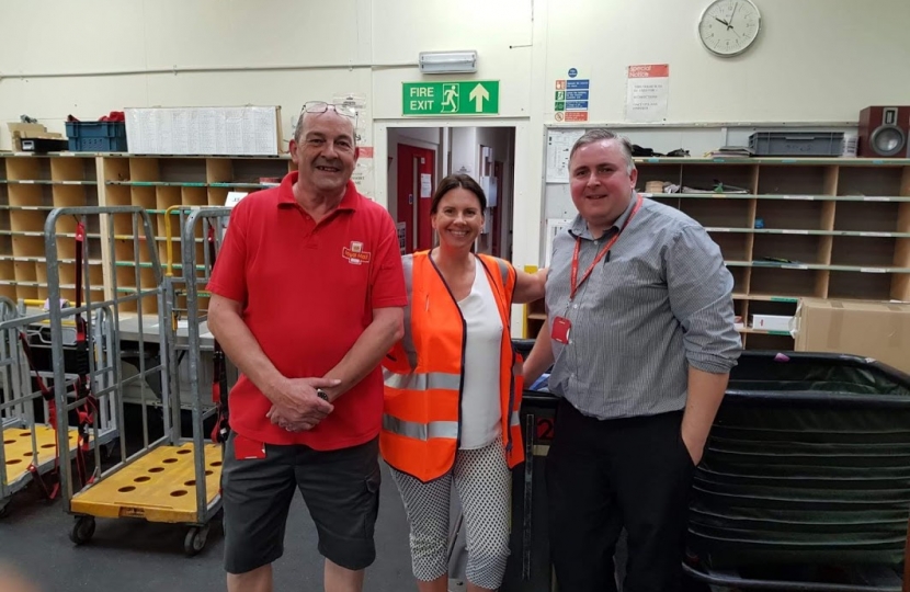 Trudy Harrison with Mike Carr and delivery office manager Steve Simpson