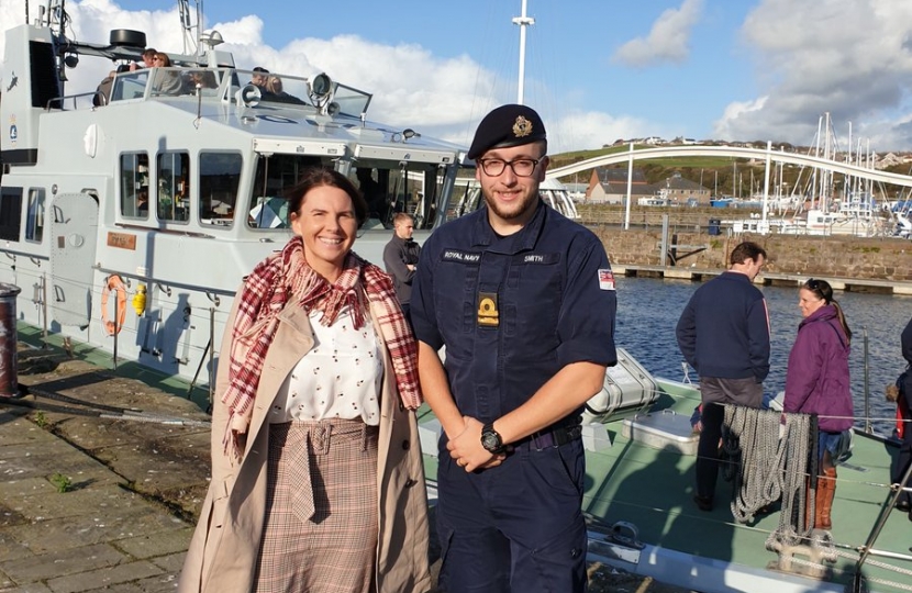 Caption: Trudy Harrison pictured with Lt Matthew Smith during HMS Biter visit
