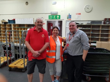 Trudy Harrison with Mike Carr and delivery office manager Steve Simpson